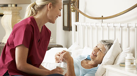 registered nurse taking care of elderly patient